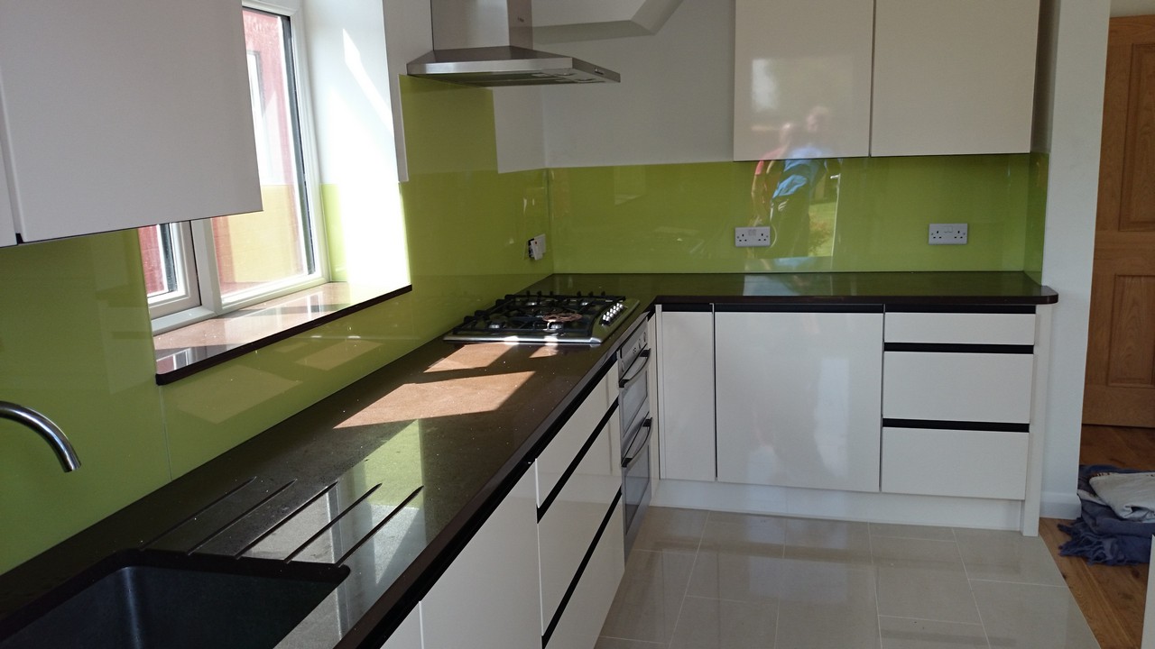 Lime green glass kitchen splashback installed by Earl's Court glaziers