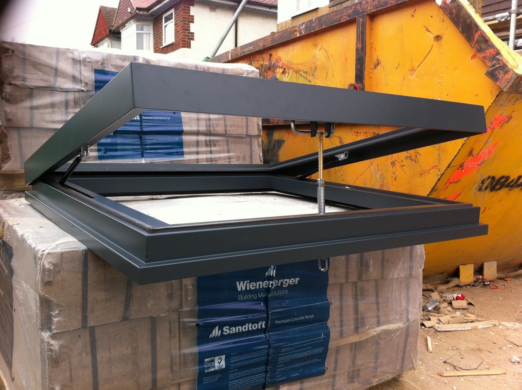 Opening flat roof skylight in anthracite grey installed in Earl's Court